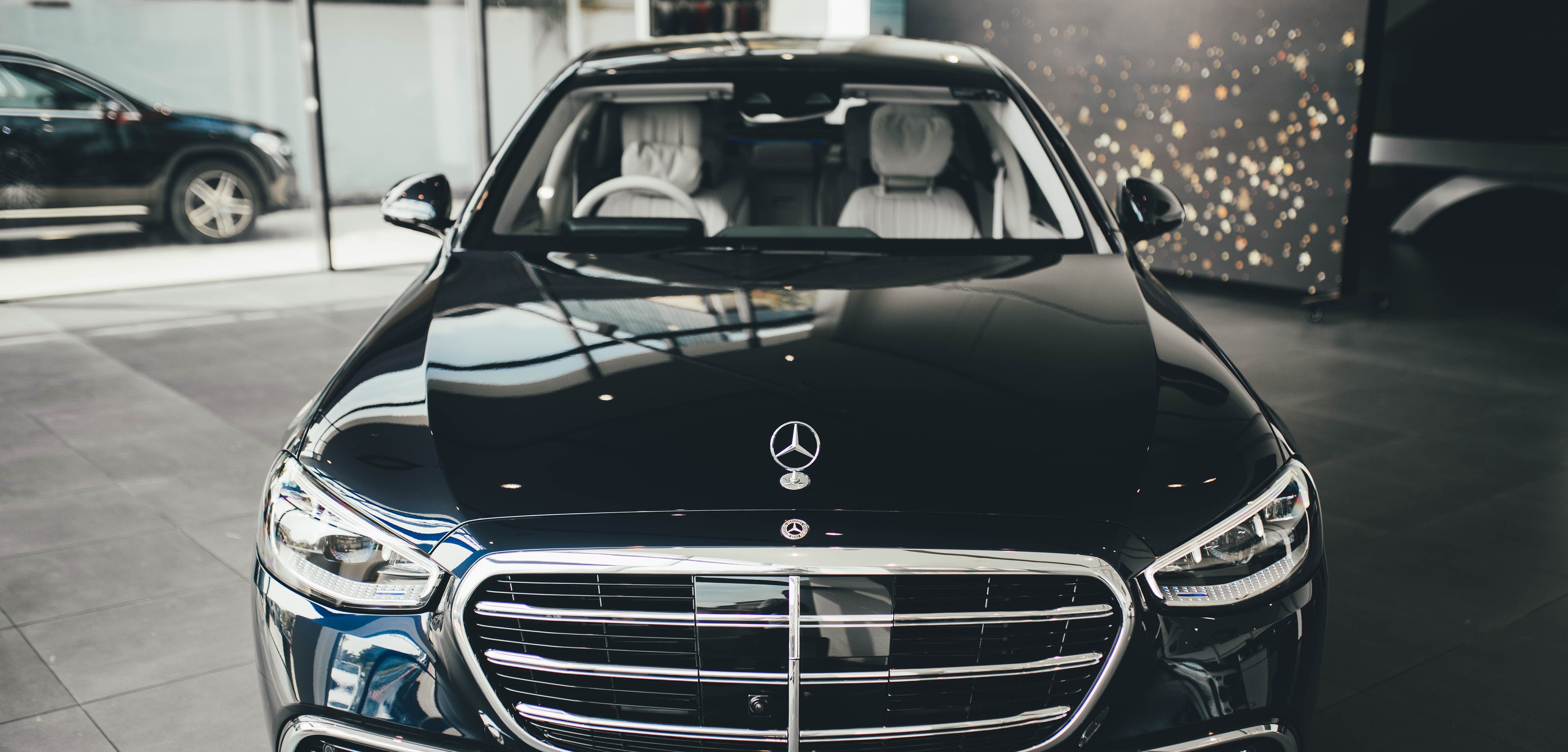 Mercedes-Benz S-Class in the showroom, front view with grille and star
